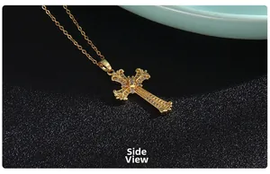 Side view of gold cross pendant with micro-inlaid zircons and vintage patterns