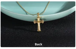 Back view detail of golden cross pendant showing fine metallic texture and craftsmanship
