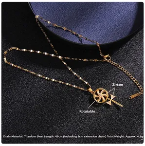 Macro view of rotating heart windmill pendant necklace in titanium steel with zircons