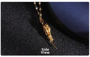 Detailed side view of golden necklace pendant with micro-set zircons and hollow design
