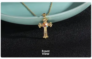 Detailed view of golden gothic cross necklace with multicolor pavé set zircon stones