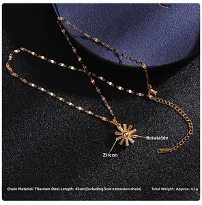 Rotating gold sunflower necklace detail with cubic zirconia and titanium steel chain