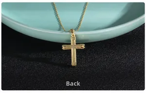 Detailed back view of golden cross pendant with hollow structure on fine chain