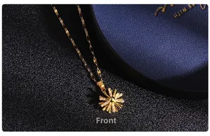 Front view detail of a gold sunflower necklace with sparkling pavé cubic zirconia