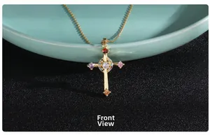 Front close-up of a gold cross necklace with vibrant zircon inlay and fine chain
