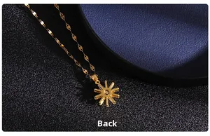 Detailed macro view of the gold heart link chain and back side of star pendant