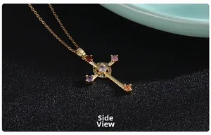 Side view of golden cross necklace with colorful micro-inlaid zircon gemstones on leather