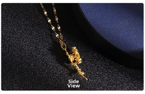 Side view detail of rotating heart pendant featuring pave-set cubic zirconia in gold