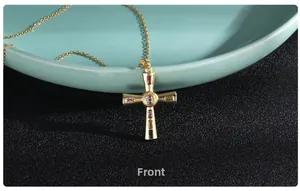 Front detail of gold cross necklace featuring colorful baguette-cut cubic zirconia stones