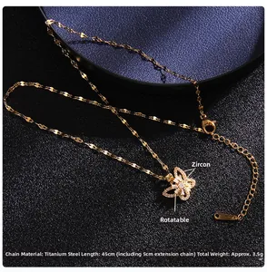 Detail view of rotating butterfly pendant with cubic zirconia and titanium steel chain