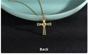 Close-up back view of gold-plated cross pendant showing detailed craftsmanship and setting
