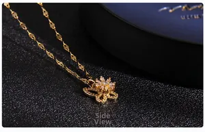 Side view of golden butterfly pendant with sparkling micro-pave zirconia details