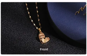 Close-up of gold heart pendant with micro-set zircons and unique flat link chain