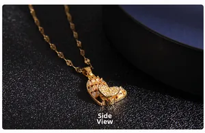 Side view of golden heart pendant necklace with shimmering micro-paved cubic zirconia