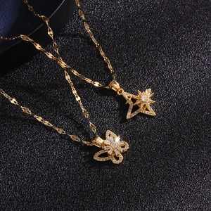Golden titanium steel rotating necklace with zircon star and butterfly heart pendants