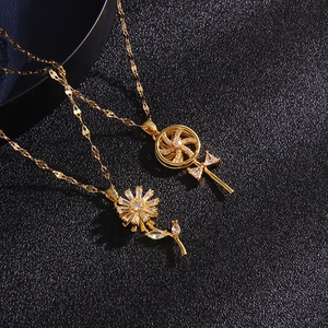 Rotating windmill and daisy necklaces in gold with sparkling zircon micro-pave inlays