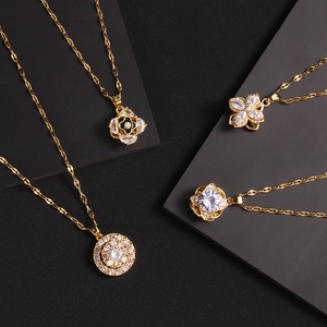 Rotating four-leaf clover and zircon pendant necklaces in gold-plated stainless steel