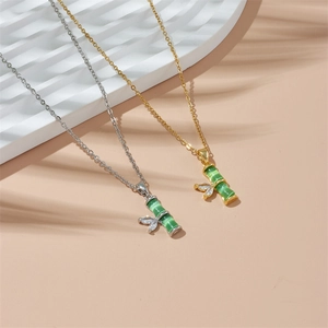 Bamboo style pendant necklaces with green cat-eye stone and zircon in gold and silver