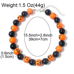 Halloween pumpkin bead necklace with orange smiley faces and black resin beads