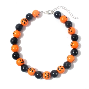 Close-up of Halloween necklace with orange Jack-o'-lantern pumpkin beads and lobster clasp