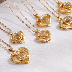 Golden heart-shaped projection necklace with 100 languages of I Love You and CZ stones