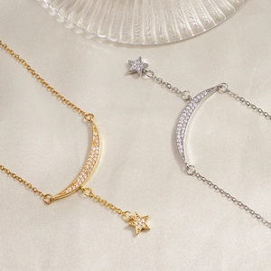 Star and moon gold-plated pendant necklace with sparkling micro-pave cubic zirconia