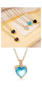 Detailed close-up of heart-shaped colored gemstone pendant with gold chain dimensions