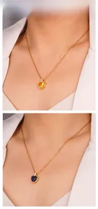 Close-up of heart-shaped zircon pendants on gold chain necklaces for elegant look