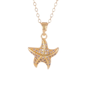 Gold starfish pendant necklace with white crystals on a delicate cable chain for women