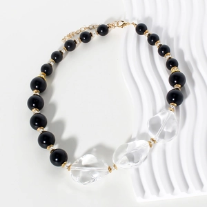 Collana di perline nere con cristalli trasparenti e distanziatori in metallo dorato lucido