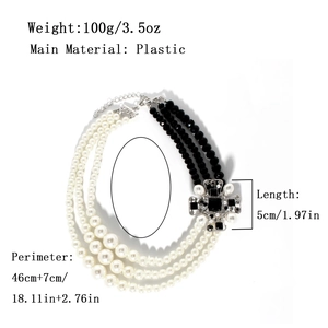 Three-layer retro necklace featuring pearls, black beads, and a crystal cross pendant
