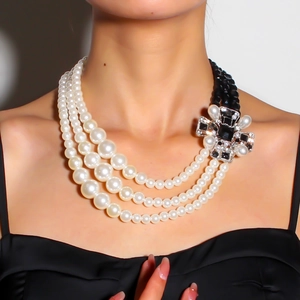 Retro multi-layer necklace with white pearls, black beads, and crystal cross pendant