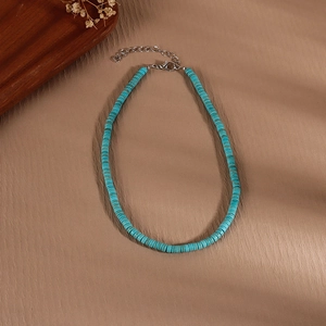 Detail of bohemian turquoise beaded necklace with adjustable silver lobster clasp