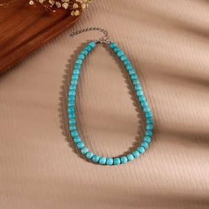 Detail of vintage turquoise beaded necklace with silver lobster clasp and extension chain