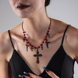 Detail of Gothic velvet necklace with red beads and black hollow cross pendants