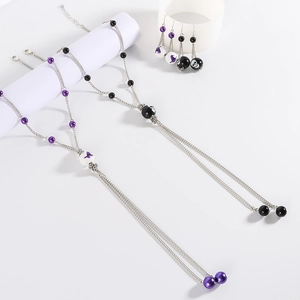 Halloween jewelry set with purple bat skull tassel necklaces and matching earrings