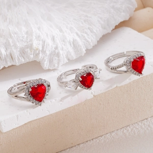 Elegant adjustable silver ring featuring a red heart zircon stone with small white diamonds