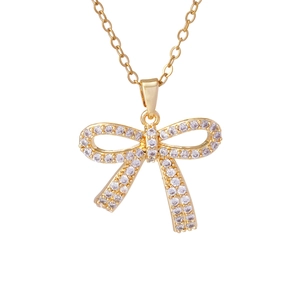 Elegant gold bow pendant necklace with sparkling cubic zirconia on a dainty chain
