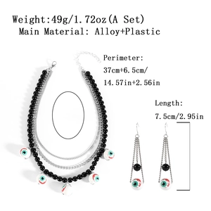 Gothic Halloween jewelry set featuring multi-layer beaded necklace and eyeball drop earrings