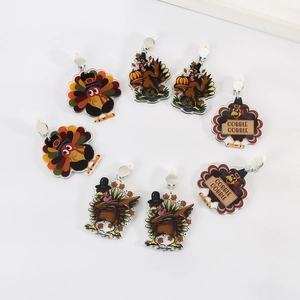 Collection of turkey acrylic earrings with festive Thanksgiving patterns and colors