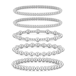Detail of 5pcs silver beaded stretch bracelet set in polished metal finish