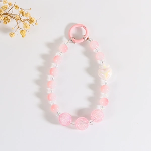 Pink beaded phone charm with crown heart and rose resin beads on white background