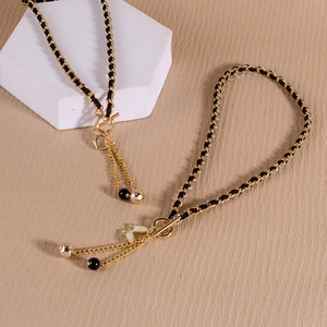 Elegant vintage gold chain necklace with black velvet butterfly pendant and toggle clasp