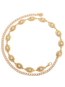 Detail of gold metal waist chain featuring white marble resin stones and lobster clasp
