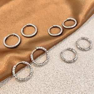 7-piece set of silver stainless steel hoop earrings with textured and geometric designs