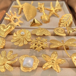 Vintage style gold plated stainless steel rings set featuring starfish and leaf designs