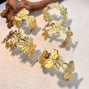 Adjustable golden stainless steel open bangles with floral daisy and rose engravings