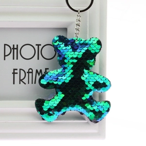 Double-sided sequin bear keychain with reversible teal and blue shimmering scales
