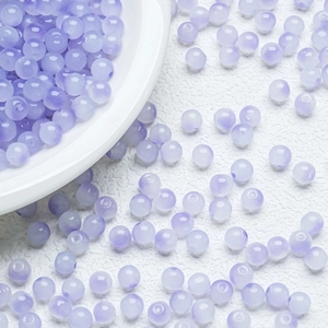 Close-up of translucent lavender round beads with polished finish for DIY jewelry