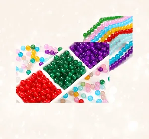 Detailed macro view of 8mm polished colorful synthetic jade beads for DIY jewelry making